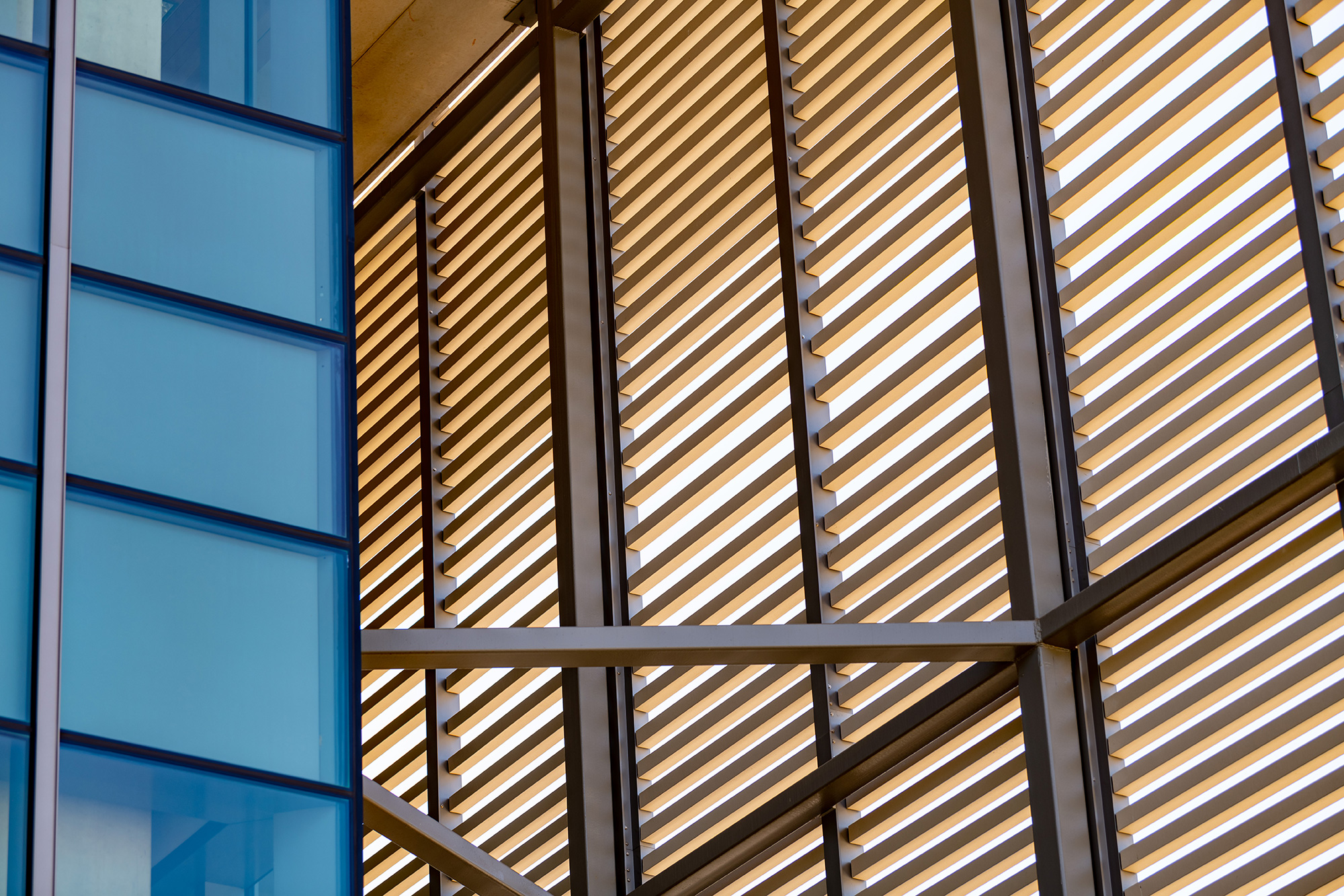 A close-up view of steel bars and glass panels found on a structural engineering job site.