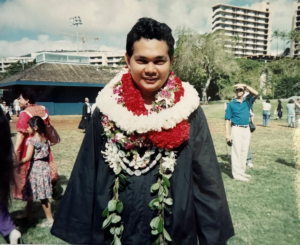 College graduate with lei